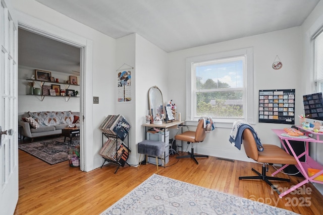 home office with wood finished floors