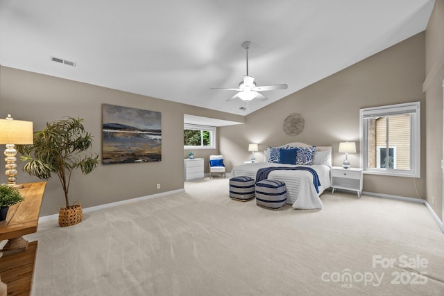 carpeted bedroom with a ceiling fan, baseboards, visible vents, and lofted ceiling
