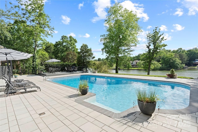 4039 5th St NW, Hickory, NC 28601 - outdoor pool with a water view, view of wooded area, and a patio area