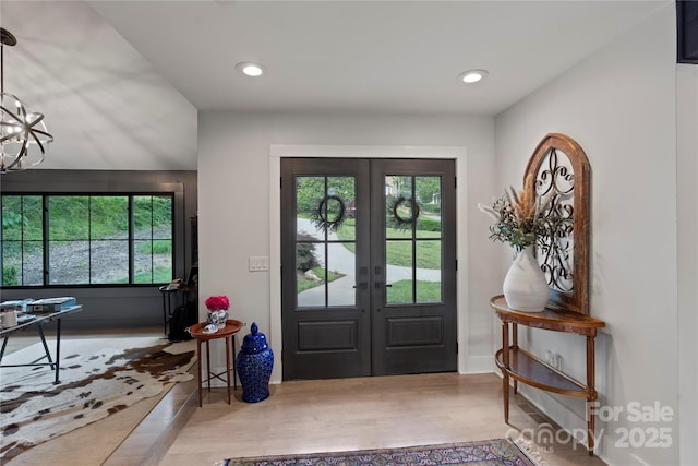 4039 5th St NW, Hickory, NC 28601 - entryway featuring french doors, wood finished floors, recessed lighting, and a chandelier