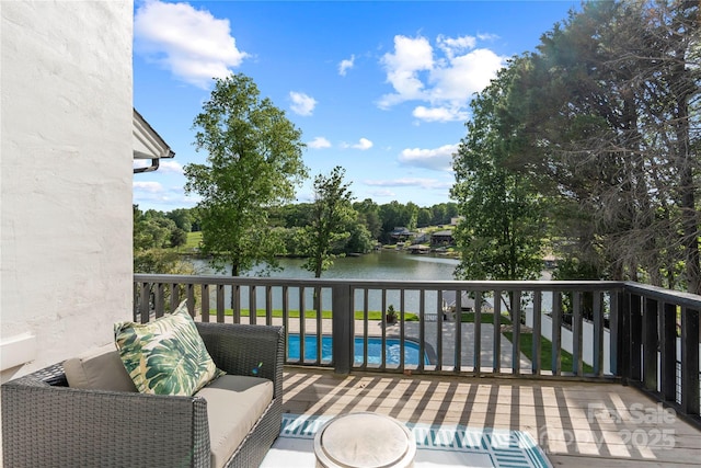4039 5th St NW, Hickory, NC 28601 - deck with a water view, an outdoor pool, an outdoor hangout area, and view of scattered trees