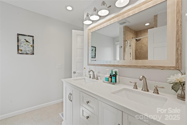 4039 5th St NW, Hickory, NC 28601 - bathroom with double vanity, tiled shower, baseboards, and tile patterned floors