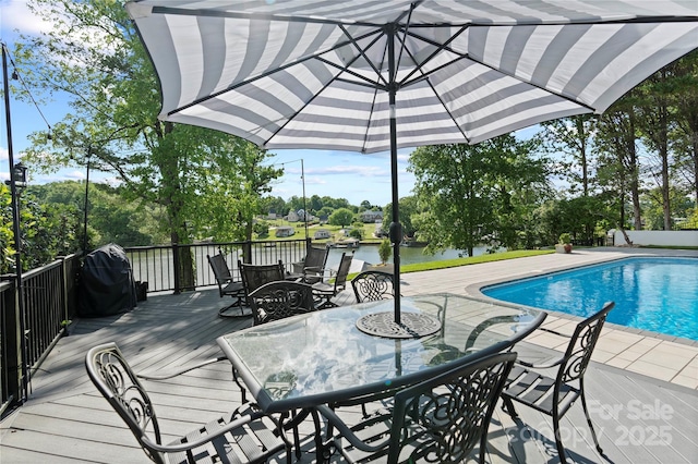 4039 5th St NW, Hickory, NC 28601 - swimming pool with outdoor dining space, a deck with water view, and view of wooded area
