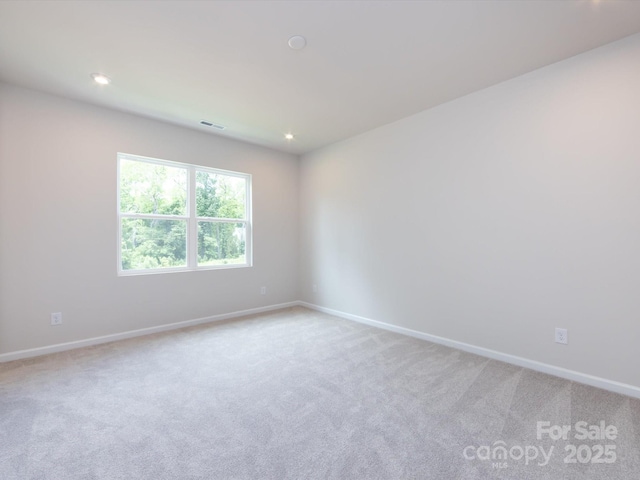 2021 Endeavor Run, Charlotte, NC 28269 - unfurnished room with light colored carpet, baseboards, and recessed lighting