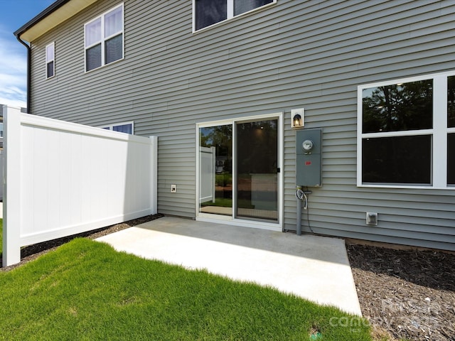 2021 Endeavor Run, Charlotte, NC 28269 - back of property featuring a patio area and a lawn
