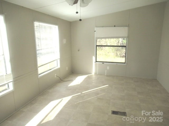5180 Macedonia Church Rd, Vale, NC 28168 - empty room with tile patterned floors and a ceiling fan