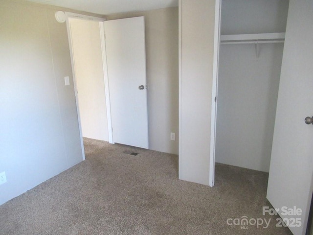 5180 Macedonia Church Rd, Vale, NC 28168 - unfurnished bedroom featuring a closet, visible vents, and carpet floors