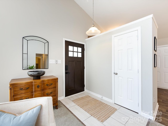 7731 Ivy Hollow Dr, Charlotte, NC 28227 - entryway featuring baseboards and high vaulted ceiling