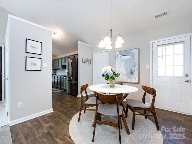 7731 Ivy Hollow Dr, Charlotte, NC 28227 - dining space featuring dark wood-type flooring, a chandelier, visible vents, and baseboards