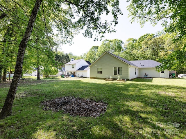7731 Ivy Hollow Dr, Charlotte, NC 28227 - rear view of house with a yard