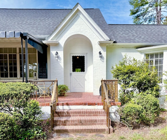 559 N Washington St, Rutherfordton, NC 28139 - view of exterior entry with brick siding, roof with shingles, and covered porch