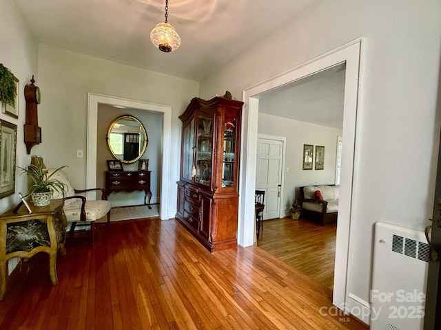 559 N Washington St, Rutherfordton, NC 28139 - hallway with radiator and wood-type flooring