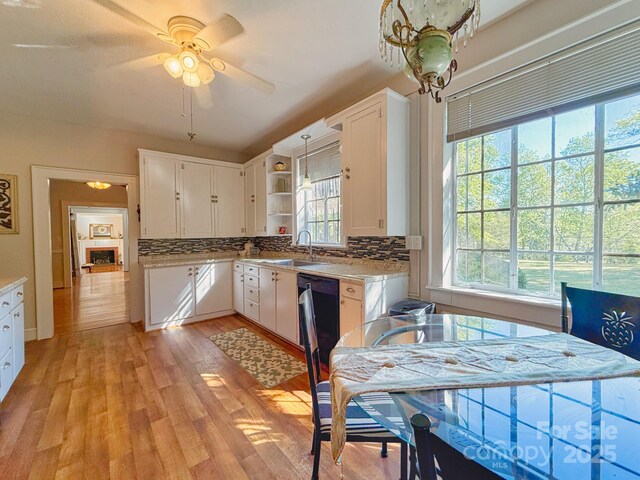 559 N Washington St, Rutherfordton, NC 28139 - kitchen with white cabinets, tasteful backsplash, open shelves, and a sink