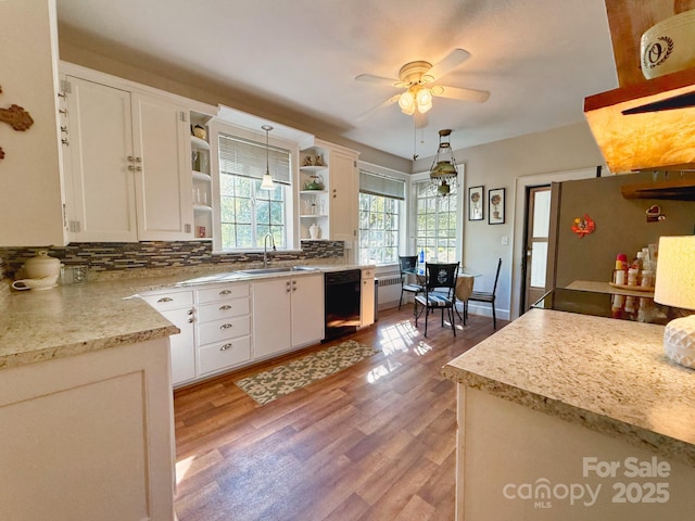 559 N Washington St, Rutherfordton, NC 28139 - kitchen featuring white cabinets, a sink, black dishwasher, ceiling fan, and open shelves
