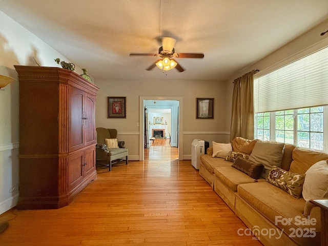 559 N Washington St, Rutherfordton, NC 28139 - living area featuring light wood-type flooring, baseboards, and ceiling fan