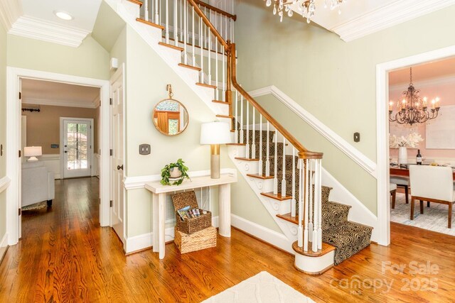 1233 Weymouth Ln, Charlotte, NC 28270 - stairs featuring a notable chandelier and ornamental molding