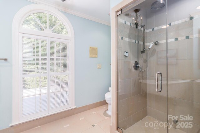 1233 Weymouth Ln, Charlotte, NC 28270 - bathroom featuring toilet, tile patterned floors, baseboards, ornamental molding, and a stall shower