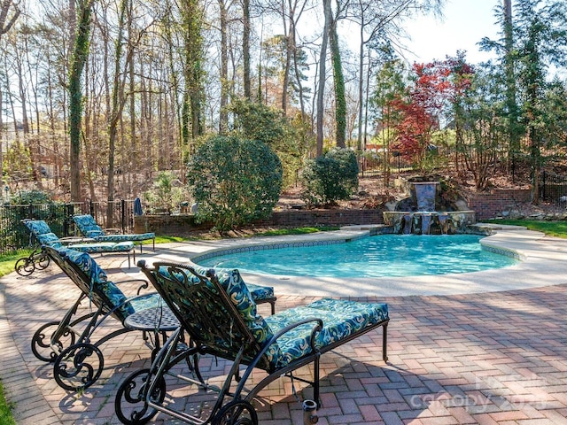 1233 Weymouth Ln, Charlotte, NC 28270 - view of swimming pool with a fenced in pool, fence, and a patio