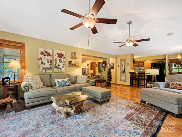 218 Red Oak Dr, Maggie Valley, NC 28751 - living area with light wood-style flooring, ceiling fan, and vaulted ceiling