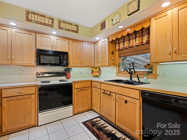 218 Red Oak Dr, Maggie Valley, NC 28751 - kitchen with black appliances, a sink, light countertops, light tile patterned floors, and a textured ceiling