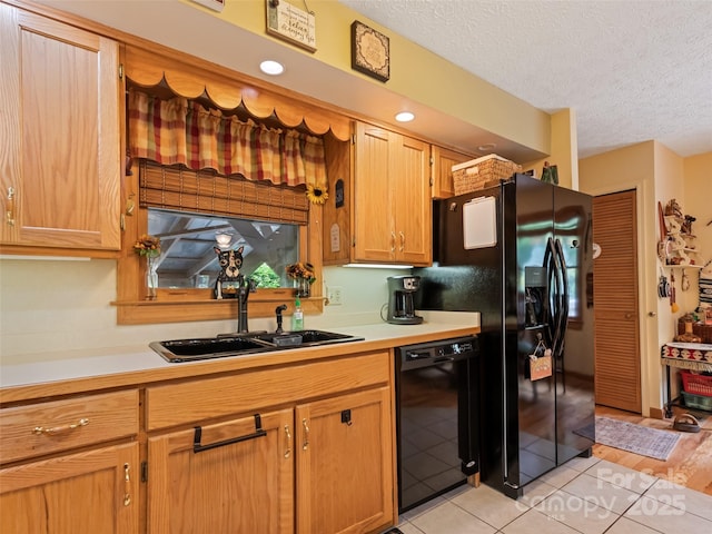 218 Red Oak Dr, Maggie Valley, NC 28751 - kitchen with black appliances, a sink, light countertops, light tile patterned flooring, and a textured ceiling