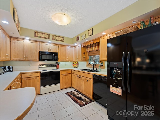 218 Red Oak Dr, Maggie Valley, NC 28751 - kitchen featuring black appliances, a sink, light countertops, a textured ceiling, and light tile patterned floors