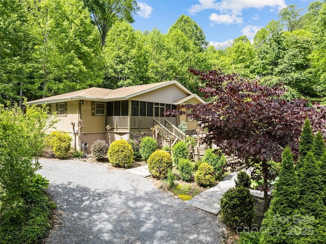 218 Red Oak Dr, Maggie Valley, NC 28751 - view of front of house with covered porch and stairs