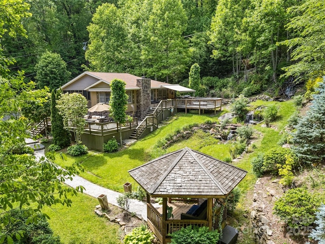 218 Red Oak Dr, Maggie Valley, NC 28751 - view of community with a gazebo, a view of trees, a wooden deck, stairs, and a lawn