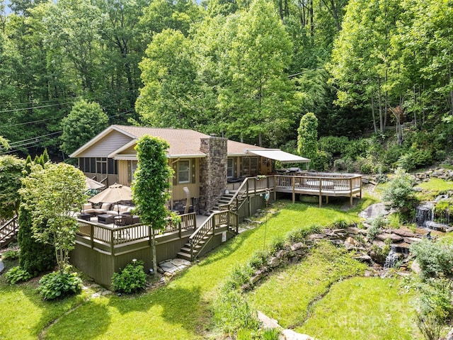 218 Red Oak Dr, Maggie Valley, NC 28751 - rear view of house featuring stairway, a deck, a forest view, and a sunroom