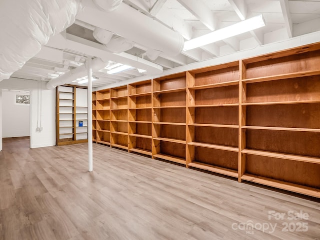 finished below grade area featuring wood finished floors