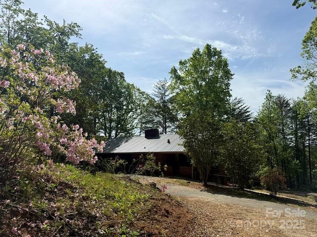 view of property exterior with metal roof