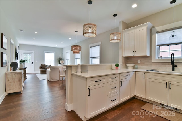 310 Portmanvilla Rd, Black Mountain, NC 28711 - kitchen with a sink, open floor plan, light countertops, backsplash, and a peninsula