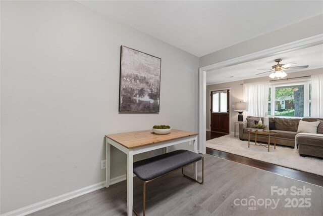 2601 Dora Dr, Charlotte, NC 28215 - dining space featuring wood finished floors, baseboards, and ceiling fan