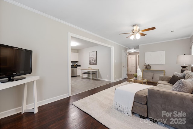 2601 Dora Dr, Charlotte, NC 28215 - living area with wood finished floors, a ceiling fan, baseboards, and ornamental molding