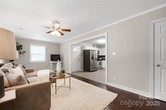 2601 Dora Dr, Charlotte, NC 28215 - living room with ceiling fan, baseboards, ornamental molding, and wood finished floors