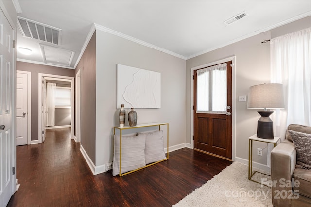 2601 Dora Dr, Charlotte, NC 28215 - entryway with baseboards, ornamental molding, wood finished floors, and visible vents