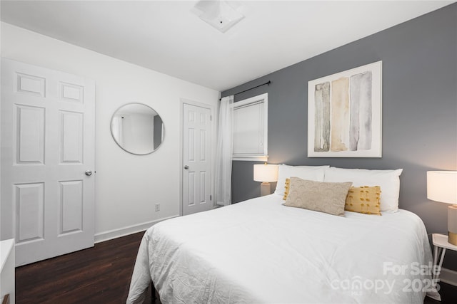 2601 Dora Dr, Charlotte, NC 28215 - bedroom with baseboards and dark wood-style floors