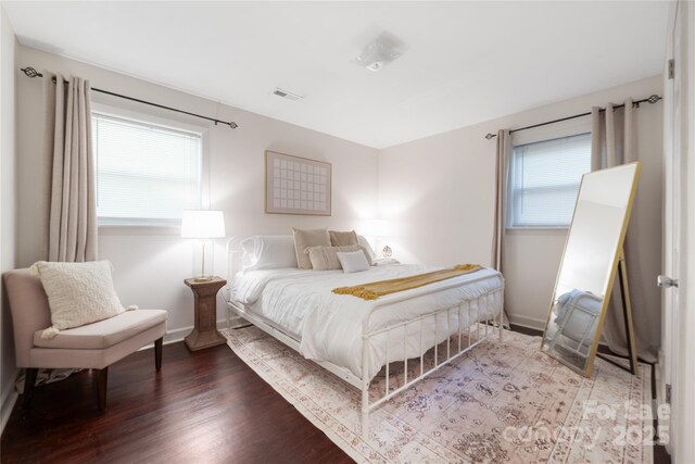 2601 Dora Dr, Charlotte, NC 28215 - bedroom with dark wood-style floors, baseboards, and visible vents