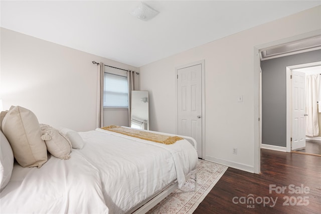 2601 Dora Dr, Charlotte, NC 28215 - bedroom with attic access, baseboards, and wood finished floors