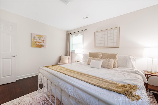 2601 Dora Dr, Charlotte, NC 28215 - bedroom featuring baseboards, wood finished floors, and visible vents