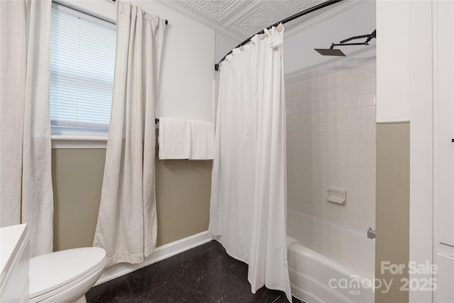 2601 Dora Dr, Charlotte, NC 28215 - full bathroom with baseboards, shower / bathtub combination with curtain, and toilet