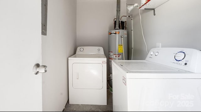 2601 Dora Dr, Charlotte, NC 28215 - clothes washing area with water heater, washing machine and clothes dryer, and laundry area