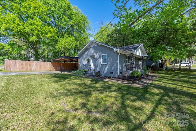 2601 Dora Dr, Charlotte, NC 28215 - exterior space featuring a lawn, fence, a porch, and driveway