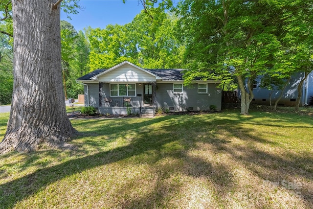 2601 Dora Dr, Charlotte, NC 28215 - view of front of property with a front lawn, crawl space, a shingled roof, and covered porch