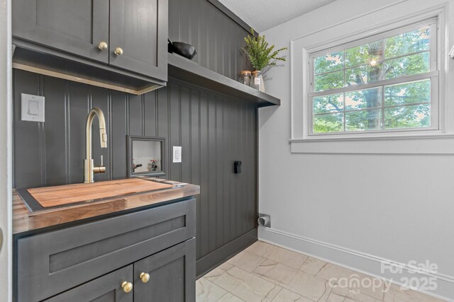 625 4th Street Dr NW, Hickory, NC 28601 - laundry room with cabinet space, a sink, hookup for a washing machine, marble finish floor, and baseboards