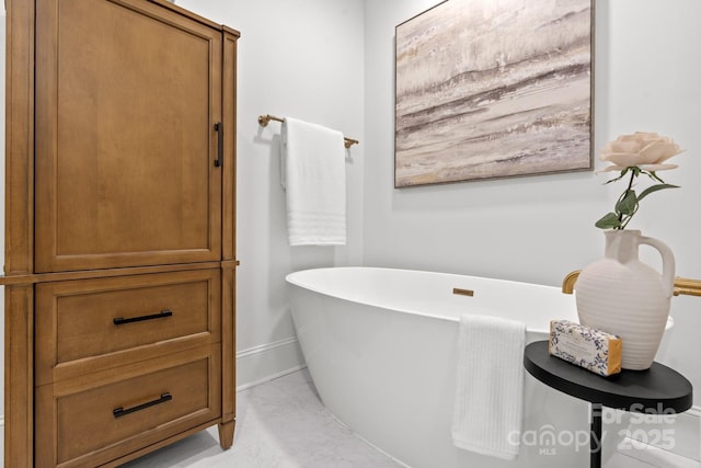 625 4th Street Dr NW, Hickory, NC 28601 - bathroom with baseboards, marble finish floor, and a soaking tub