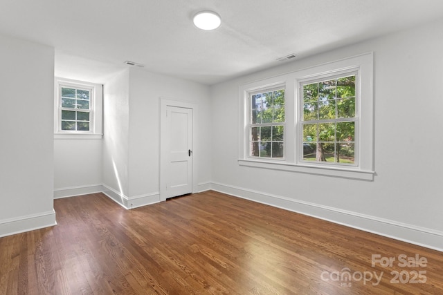 625 4th Street Dr NW, Hickory, NC 28601 - empty room featuring a wealth of natural light, dark wood-style flooring, and visible vents