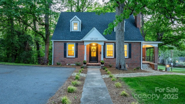 625 4th Street Dr NW, Hickory, NC 28601 - cape cod-style house featuring brick siding, roof with shingles, and a chimney
