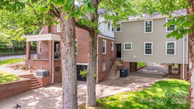 625 4th Street Dr NW, Hickory, NC 28601 - rear view of property with stairs, driveway, and brick siding