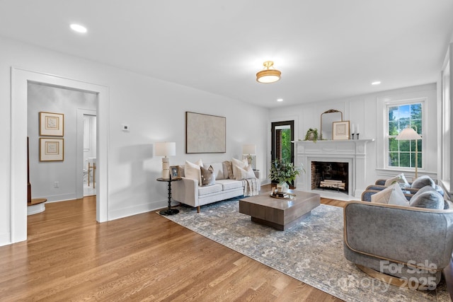 625 4th Street Dr NW, Hickory, NC 28601 - living room with recessed lighting, baseboards, a fireplace with flush hearth, and light wood-style flooring